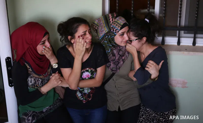 Palestinian women mourn during the funeral of Palestinian youth Laith al-Khaldi near the West Bank city of Ramallah August 1, 2015. Al-Khaldi died on Saturday at a West Bank hospital following a clash with Israeli troops...