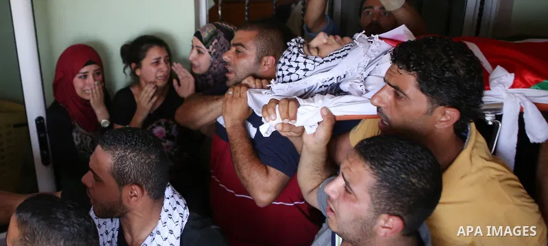 Mourners carry the body of Palestinian youth Laith al-Khaldi during his funeral near the West Bank city of Ramallah August 1, 2015. Al-Khaldi died on Saturday at a West Bank hospital following a clash with Israeli troops...