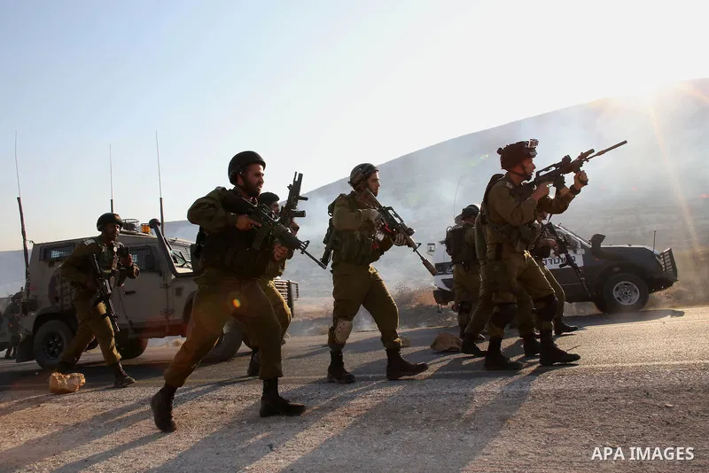 Israeli soldiers clash with Palestinians at the entrance of Duma village near the West Bank city of Nablus, Saturday, Aug. 1, 2015. Tensions remain high after suspected Jewish assailants set fire to a West Bank home and...