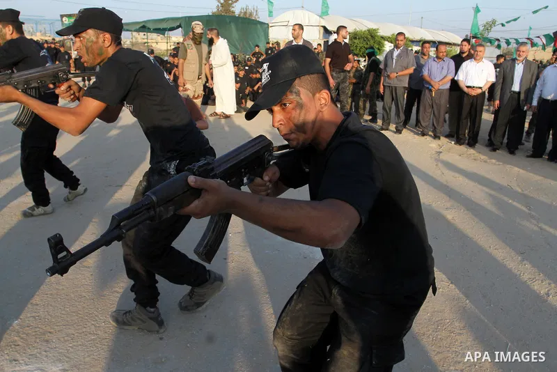Palestinian youths demonstrate their skills during a military-style exercise at the Liberation Youths summer camp, organised by the Hamas movement, in Rafah in the southern Gaza Strip August 1, 2015. Hamas stages dozens...