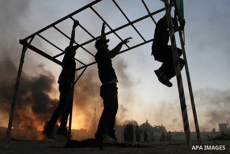 Palestinian youths demonstrate their skills during a military-style exercise at the Liberation Youths summer camp, organised by the Hamas movement, in Rafah in the southern Gaza Strip August 1, 2015. Hamas stages dozens...