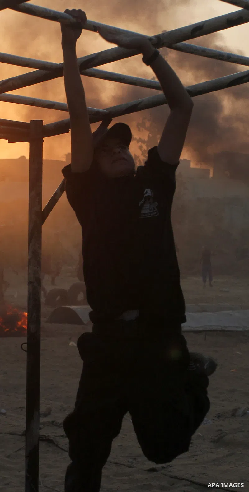 Palestinian youths demonstrate their skills during a military-style exercise at the Liberation Youths summer camp, organised by the Hamas movement, in Rafah in the southern Gaza Strip August 1, 2015. Hamas stages dozens...