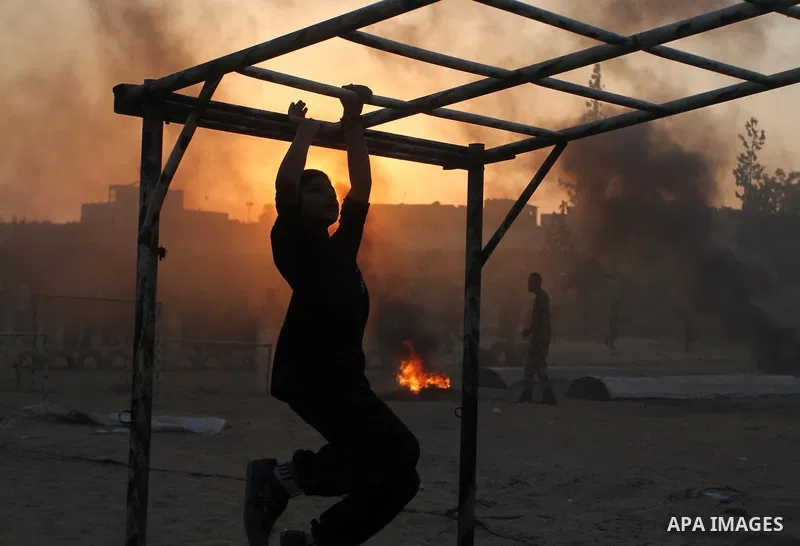 Palestinian youths demonstrate their skills during a military-style exercise at the Liberation Youths summer camp, organised by the Hamas movement, in Rafah in the southern Gaza Strip August 1, 2015. Hamas stages dozens...
