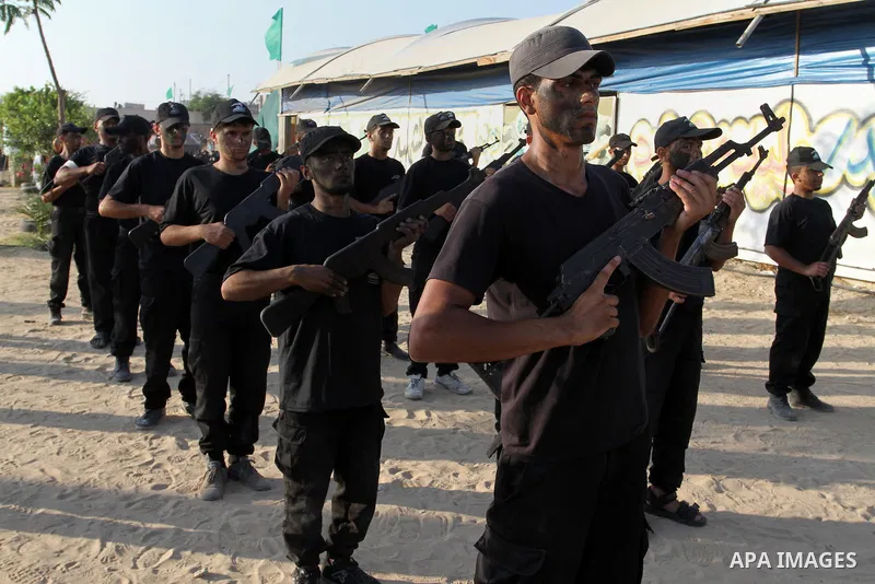 Palestinian youths demonstrate their skills during a military-style exercise at the Liberation Youths summer camp, organised by the Hamas movement, in Rafah in the southern Gaza Strip August 1, 2015. Hamas stages dozens...