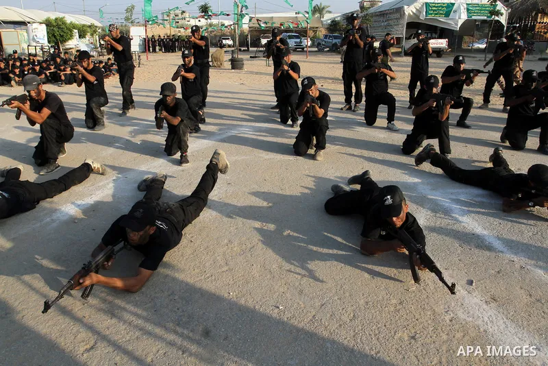 Palestinian youths demonstrate their skills during a military-style exercise at the Liberation Youths summer camp, organised by the Hamas movement, in Rafah in the southern Gaza Strip August 1, 2015. Hamas stages dozens...
