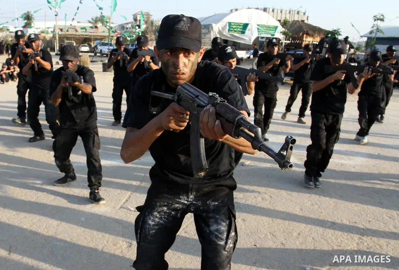 Palestinian youths demonstrate their skills during a military-style exercise at the Liberation Youths summer camp, organised by the Hamas movement, in Rafah in the southern Gaza Strip August 1, 2015. Hamas stages dozens...