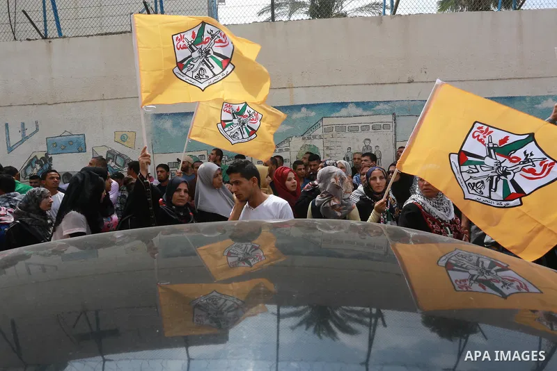 Palestinians hold banners during a protest against the UNRWA decision to reduce of the aid in front of the headquarters United Nations Relief and Works Agency (UNRWA), in Gaza city on August 2, 2015. Photo by Mohammed As...