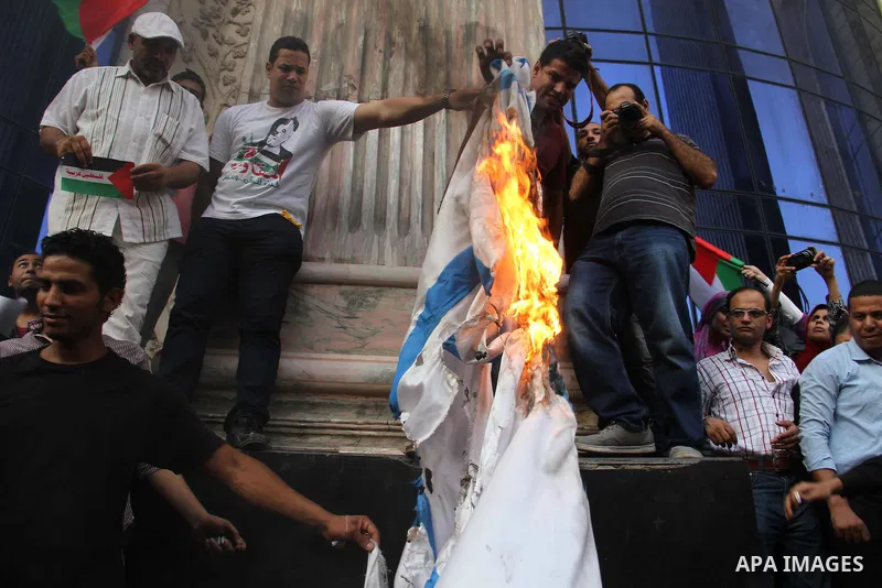 Egyptian journalists take part in a protest against the killing of 18-month-old Palestinian Ali Saad Dawabsheh, the toddler who was burned to death by suspected Jewish extremists, in front of the Journalists Syndicate, i...