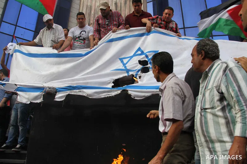 Egyptian journalists take part in a protest against the killing of 18-month-old Palestinian Ali Saad Dawabsheh, the toddler who was burned to death by suspected Jewish extremists, in front of the Journalists Syndicate, i...