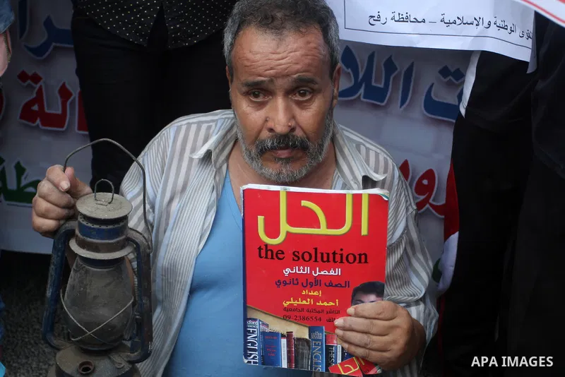 Palestinians take part in a protest against the UNRWA decision to reduce of the aid in Rafah in the southern Gaza strip on August 4, 2015. The United Nations Relief and Works Agency for Palestinians in the Near East (UNR...
