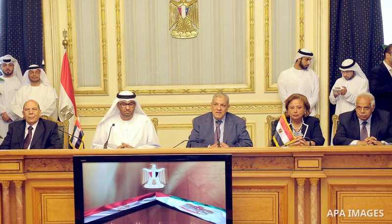 Egypt's Prime Minister Ibrahim Mahlab attends a signing ceremony with UAE minister of State Sultan Ahmed Al-Jaber, in Cairo on August 4, 2015. Mahlab, witnessed, today, the signings of delivery protocols for four of the...