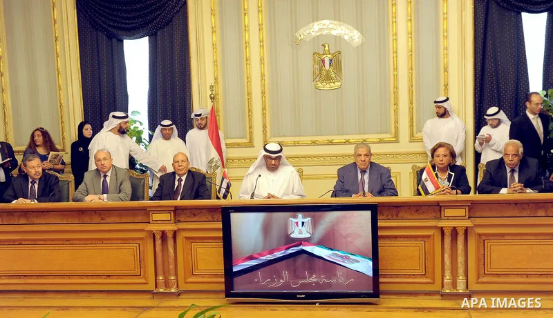 Egypt's Prime Minister Ibrahim Mahlab attends a signing ceremony with UAE minister of State Sultan Ahmed Al-Jaber, in Cairo on August 4, 2015. Mahlab, witnessed, today, the signings of delivery protocols for four of the...