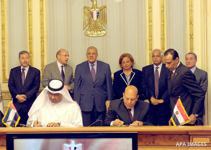 Egypt's Prime Minister Ibrahim Mahlab attends a signing ceremony with UAE minister of State Sultan Ahmed Al-Jaber, in Cairo on August 4, 2015. Mahlab, witnessed, today, the signings of delivery protocols for four of the...