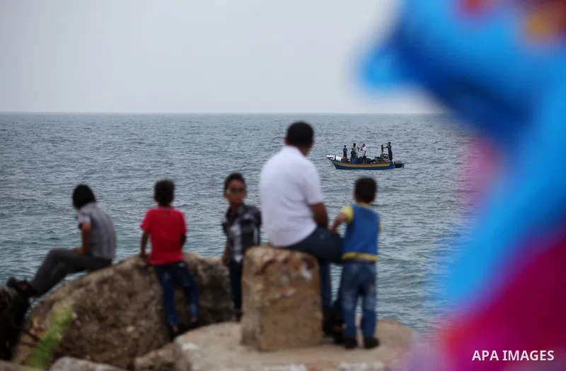 Palestinians enjoy the beach of the Mediterranean Sea on the coast of Gaza City on August 4, 2015. Across the Middle East, temperatures in the high 30’s Centigrade (upper 90’s Fahrenheit) and as high as 50 (122 Fahrenhei...