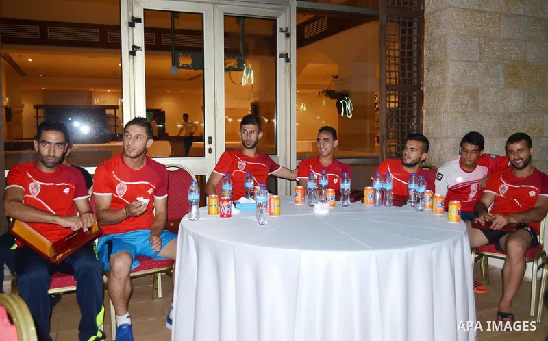 Members of the Hebron's Al-Ahly soccer team, attend a reception ceremony in Gaza city on August 4, 2015. The soccer teams of the Gaza Strip's Shejaia and al-Ahly from Hebron in the Israeli-occupied West Bank will play a...