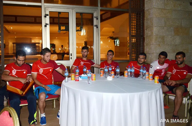 Members of the Hebron's Al-Ahly soccer team, attend a reception ceremony in Gaza city on August 4, 2015. The soccer teams of the Gaza Strip's Shejaia and al-Ahly from Hebron in the Israeli-occupied West Bank will play a...