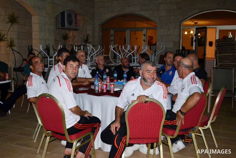 Members of the Shejaia soccer team, attend a reception ceremony of the Hebron's Al-Ahly team in Gaza city on August 4, 2015. The soccer teams of the Gaza Strip's Shejaia and al-Ahly from Hebron in the Israeli-occupied We...