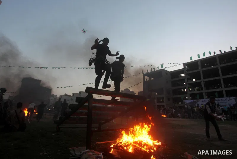 Palestinian youths demonstrate their skills during graduation ceremony of a military-style camp organized by the Hamas movement in Gaza City on August 5, 2015. Hamas's armed wing organized ''Liberation Youths Camps'' for...
