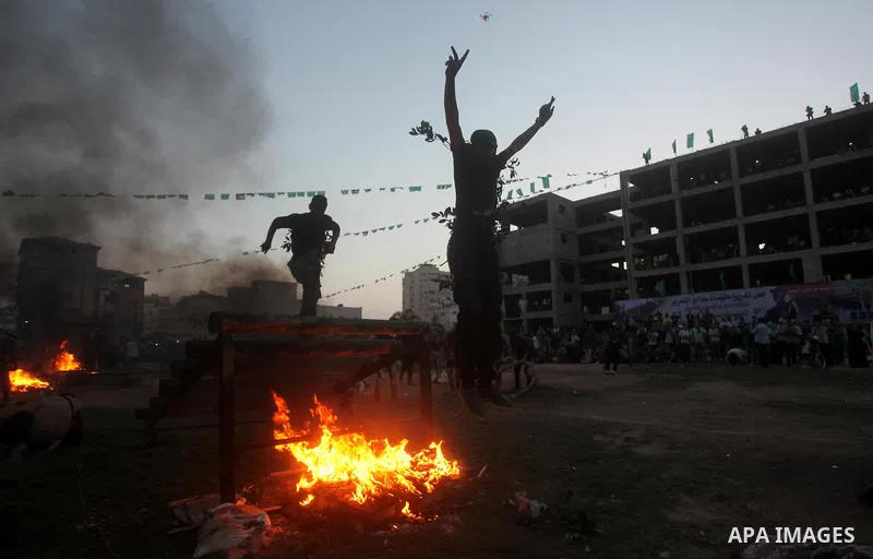 Palestinian youths demonstrate their skills during graduation ceremony of a military-style camp organized by the Hamas movement in Gaza City on August 5, 2015. Hamas's armed wing organized ''Liberation Youths Camps'' for...