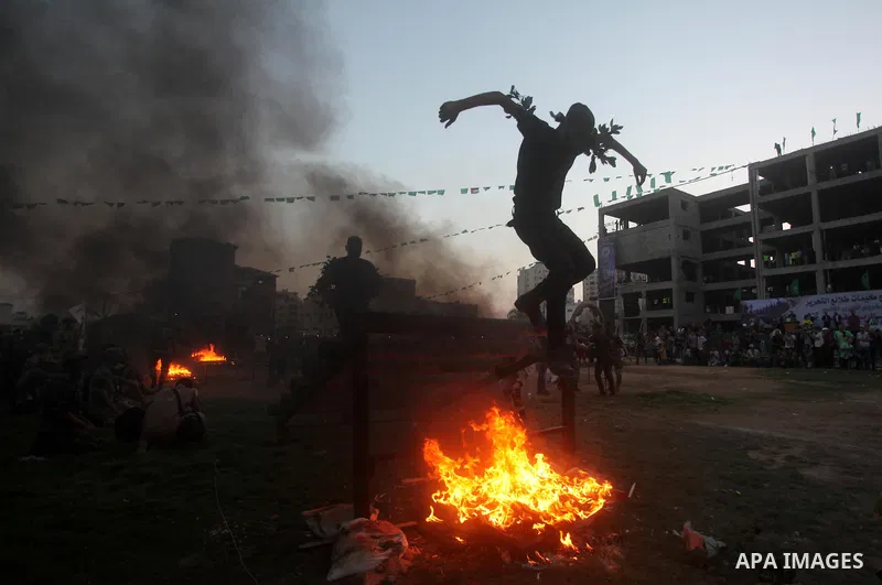 Palestinian youths demonstrate their skills during graduation ceremony of a military-style camp organized by the Hamas movement in Gaza City on August 5, 2015. Hamas's armed wing organized ''Liberation Youths Camps'' for...