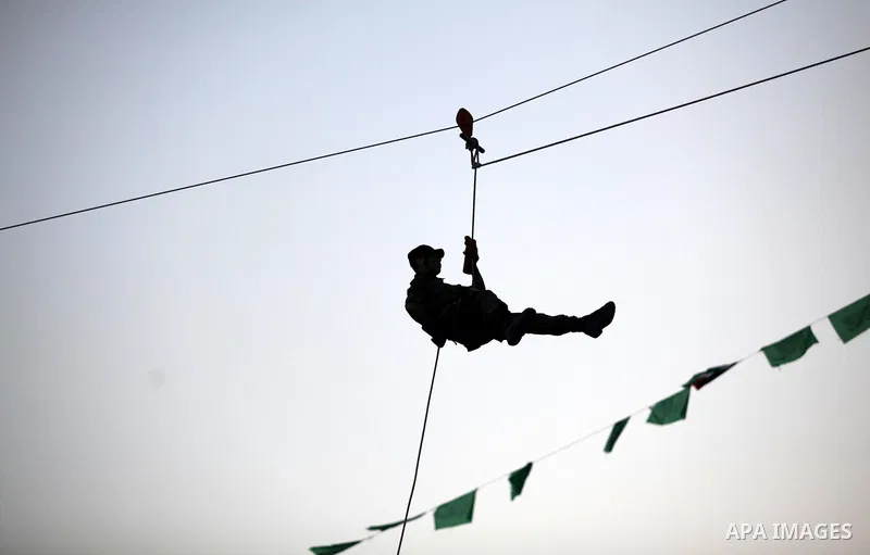 Palestinian youths demonstrate their skills during graduation ceremony of a military-style camp organized by the Hamas movement in Gaza City on August 5, 2015. Hamas's armed wing organized ''Liberation Youths Camps'' for...