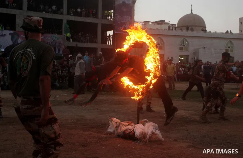 Palestinian youths demonstrate their skills during graduation ceremony of a military-style camp organized by the Hamas movement in Gaza City on August 5, 2015. Hamas's armed wing organized ''Liberation Youths Camps'' for...