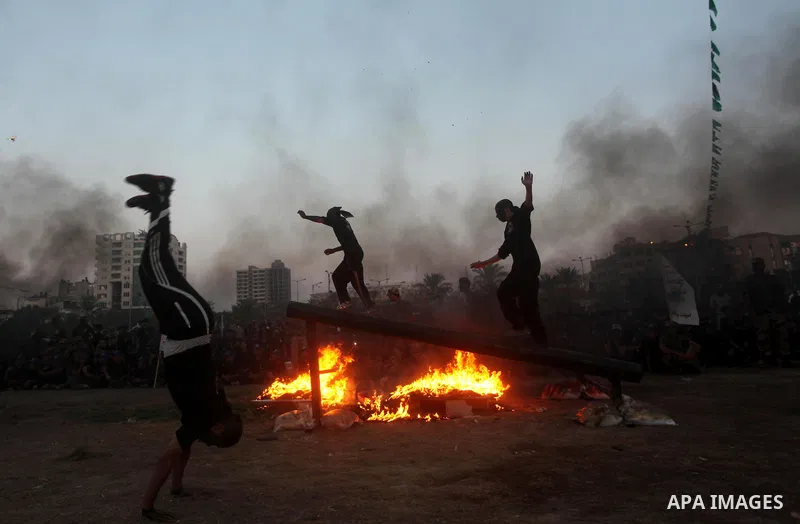 Palestinian youths demonstrate their skills during graduation ceremony of a military-style camp organized by the Hamas movement in Gaza City on August 5, 2015. Hamas's armed wing organized ''Liberation Youths Camps'' for...