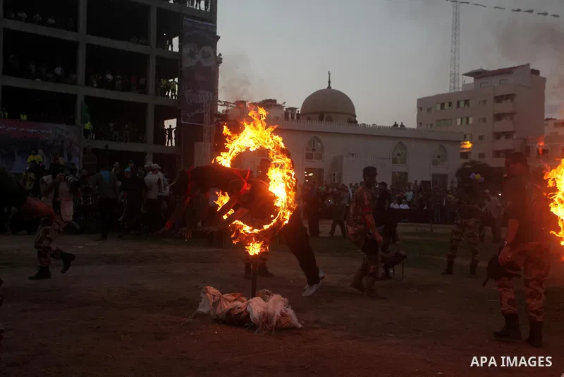 Palestinian youths demonstrate their skills during graduation ceremony of a military-style camp organized by the Hamas movement in Gaza City on August 5, 2015. Hamas's armed wing organized ''Liberation Youths Camps'' for...