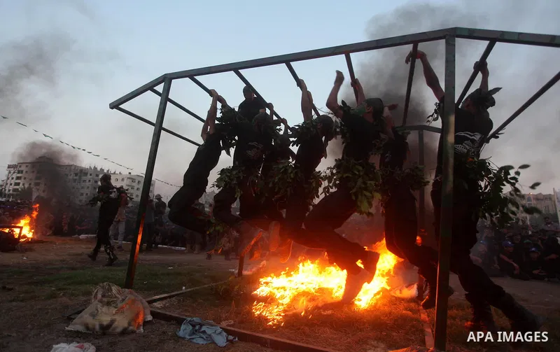 Palestinian youths demonstrate their skills during graduation ceremony of a military-style camp organized by the Hamas movement in Gaza City on August 5, 2015. Hamas's armed wing organized ''Liberation Youths Camps'' for...