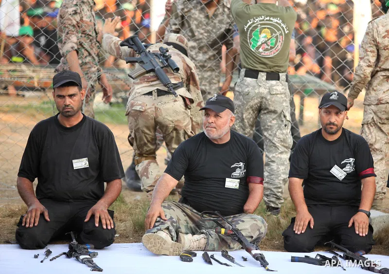 Palestinian men demonstrate their skills during graduation ceremony of a military-style camp organized by the Hamas movement in Gaza City on August 5, 2015. Hamas's armed wing organized ''Liberation Youths Camps'' for yo...