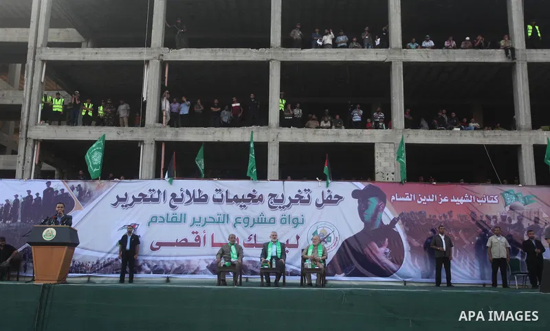 Senior Hamas leader Ismail Haniyeh attends a graduation ceremony of a military-style camp organized by the Hamas movement in Gaza City on August 5, 2015. Hamas's armed wing organized ''Liberation Youths Camps'' for young...