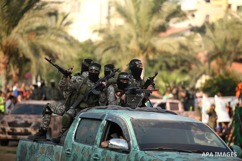 Members of Ezzedin al-Qassam Brigades, the armed wing of Hamas movement, take part in a graduation ceremony of a military-style camp organized by the Hamas movement in Gaza City on August 5, 2015. Hamas's armed wing orga...