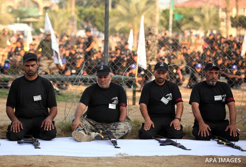 Palestinian men demonstrate their skills during graduation ceremony of a military-style camp organized by the Hamas movement in Gaza City on August 5, 2015. Hamas's armed wing organized ''Liberation Youths Camps'' for yo...