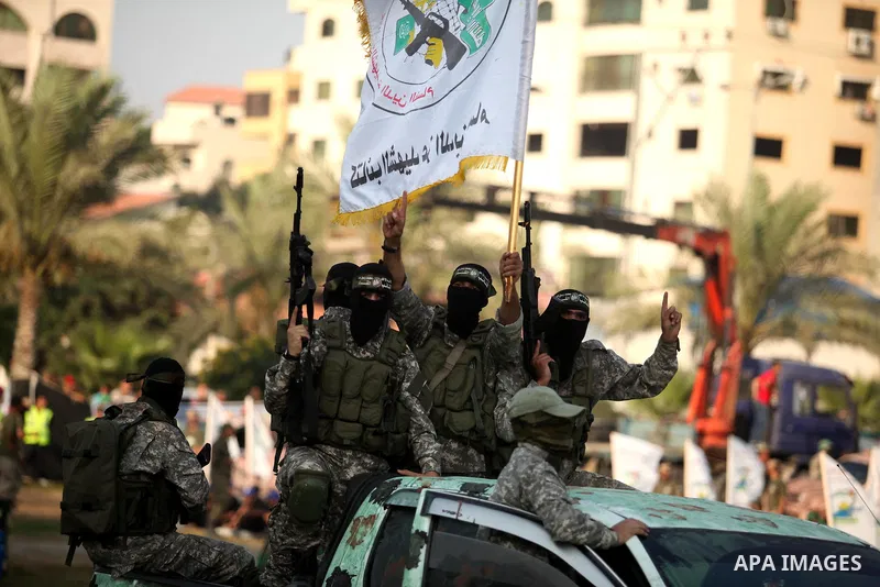 Members of Ezzedin al-Qassam Brigades, the armed wing of Hamas movement, take part in a graduation ceremony of a military-style camp organized by the Hamas movement in Gaza City on August 5, 2015. Hamas's armed wing orga...