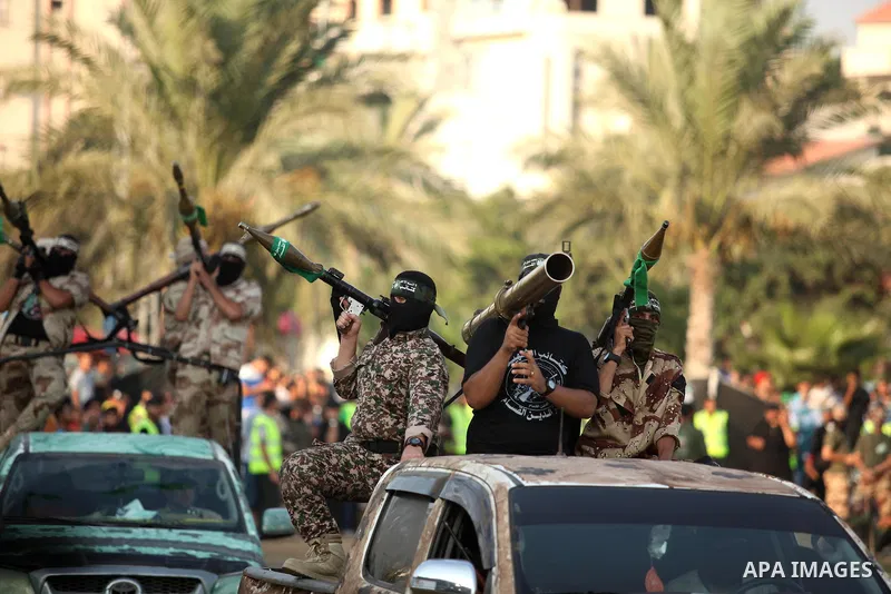 Members of Ezzedin al-Qassam Brigades, the armed wing of Hamas movement, take part in a graduation ceremony of a military-style camp organized by the Hamas movement in Gaza City on August 5, 2015. Hamas's armed wing orga...