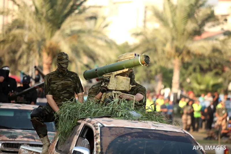 Members of Ezzedin al-Qassam Brigades, the armed wing of Hamas movement, take part in a graduation ceremony of a military-style camp organized by the Hamas movement in Gaza City on August 5, 2015. Hamas's armed wing orga...