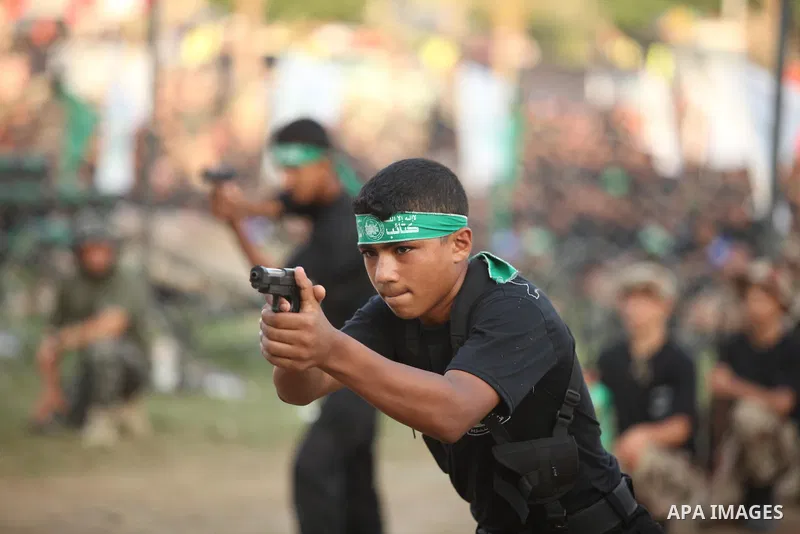 Palestinian youths demonstrate their skills during graduation ceremony of a military-style camp organized by the Hamas movement in Gaza City on August 5, 2015. Hamas's armed wing organized ''Liberation Youths Camps'' for...