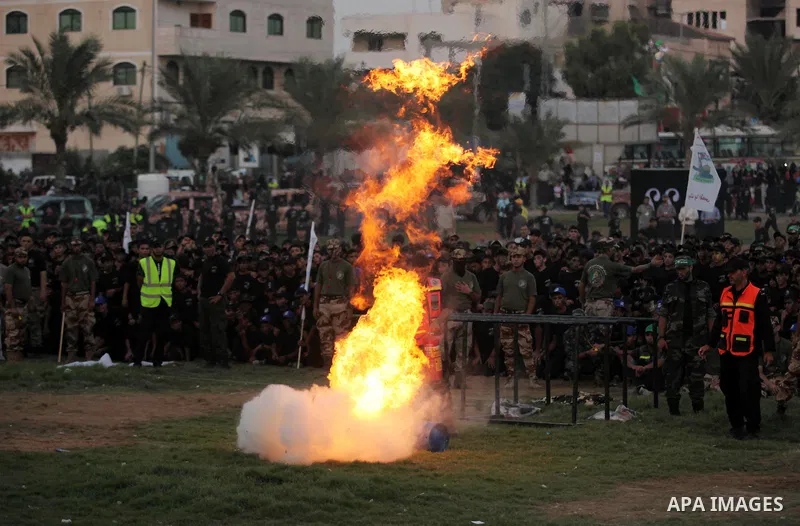 Palestinian youths demonstrate their skills during graduation ceremony of a military-style camp organized by the Hamas movement in Gaza City on August 5, 2015. Hamas's armed wing organized ''Liberation Youths Camps'' for...
