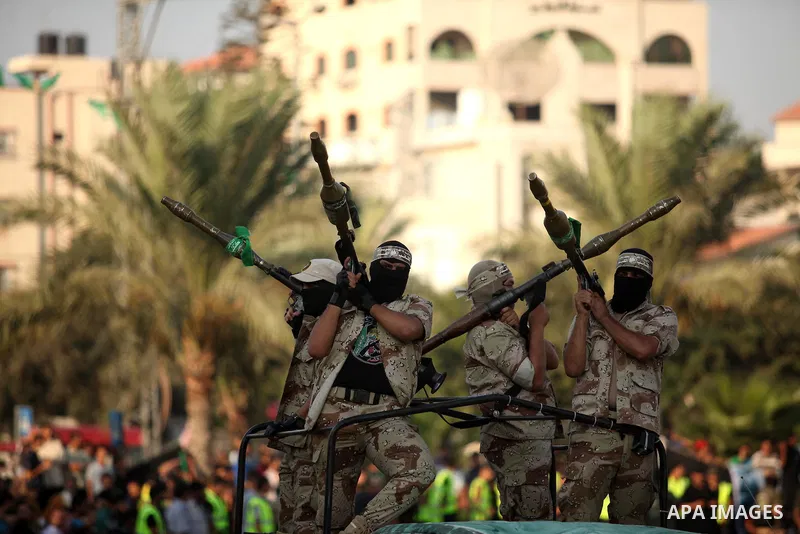 Members of Ezzedin al-Qassam Brigades, the armed wing of Hamas movement, take part in a graduation ceremony of a military-style camp organized by the Hamas movement in Gaza City on August 5, 2015. Hamas's armed wing orga...