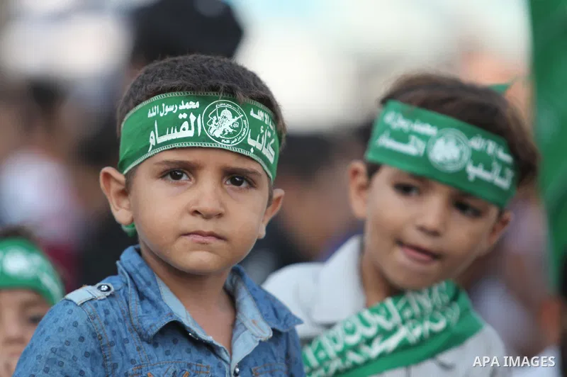 Palestinian children attend a graduation ceremony of a military-style camp organized by the Hamas movement in Gaza City on August 5, 2015. Hamas's armed wing organized ''Liberation Youths Camps'' for young Palestinians a...
