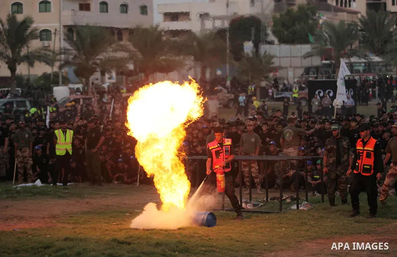 Palestinian youths demonstrate their skills during graduation ceremony of a military-style camp organized by the Hamas movement in Gaza City on August 5, 2015. Hamas's armed wing organized ''Liberation Youths Camps'' for...