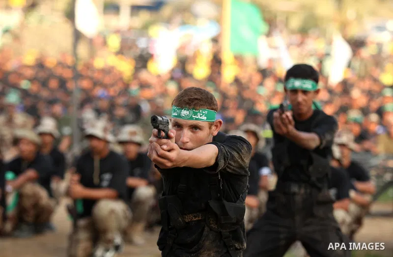Palestinian youths demonstrate their skills during graduation ceremony of a military-style camp organized by the Hamas movement in Gaza City on August 5, 2015. Hamas's armed wing organized ''Liberation Youths Camps'' for...