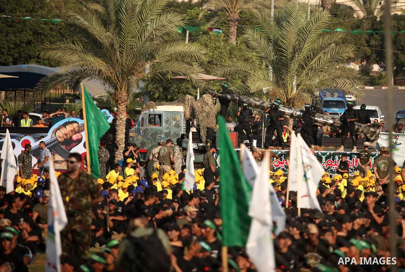 Palestinians attend a graduation ceremony of a military-style camp organized by the Hamas movement in Gaza City on August 5, 2015. Hamas's armed wing organized ''Liberation Youths Camps'' for young Palestinians aged betw...
