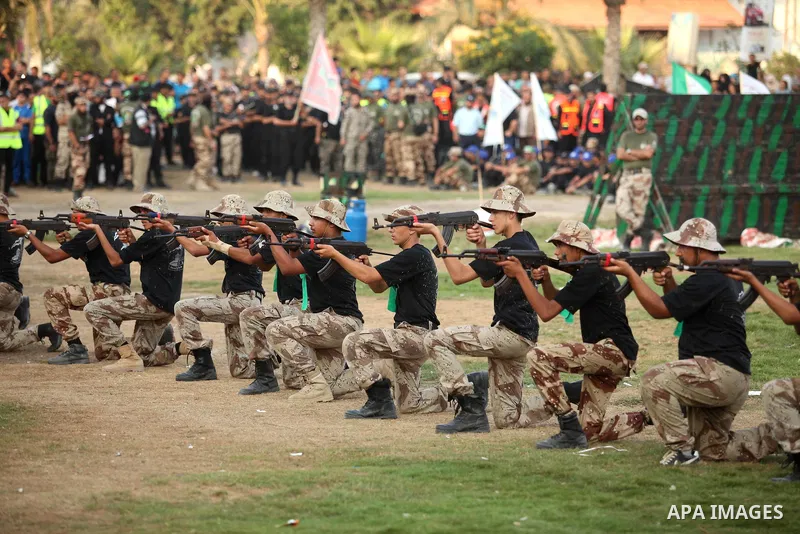 Palestinian youths demonstrate their skills during graduation ceremony of a military-style camp organized by the Hamas movement in Gaza City on August 5, 2015. Hamas's armed wing organized ''Liberation Youths Camps'' for...