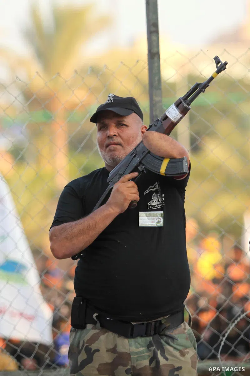 A Palestinian man demonstrates his skills during graduation ceremony of a military-style camp organized by the Hamas movement in Gaza City on August 5, 2015. Hamas's armed wing organized ''Liberation Youths Camps'' for y...