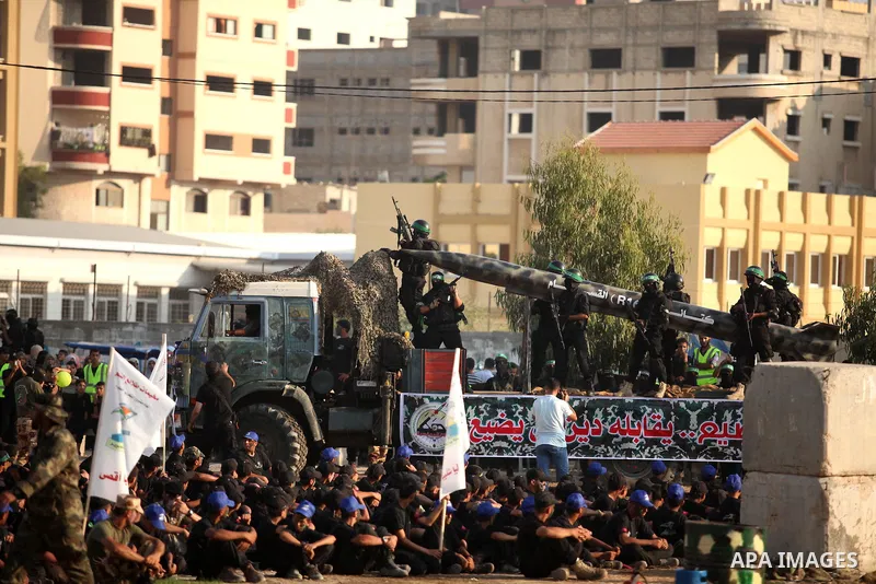 Palestinians attend a graduation ceremony of a military-style camp organized by the Hamas movement in Gaza City on August 5, 2015. Hamas's armed wing organized ''Liberation Youths Camps'' for young Palestinians aged betw...
