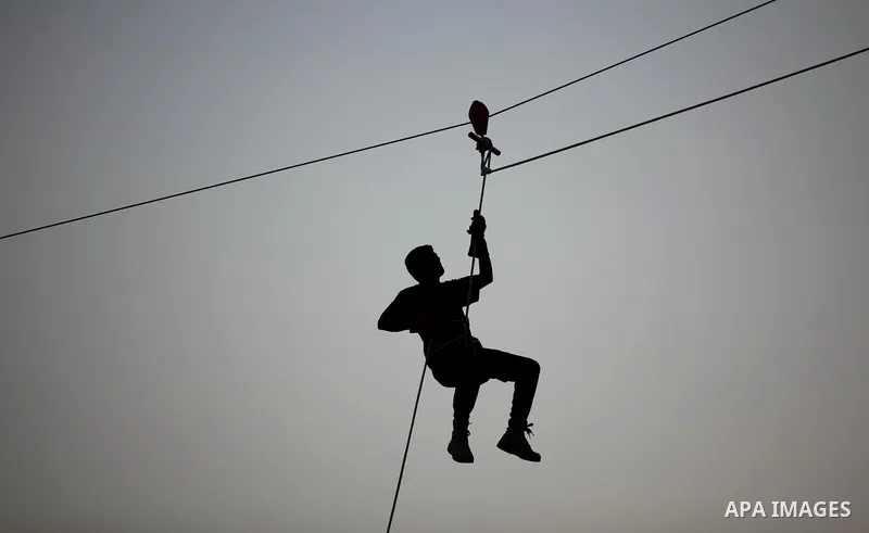 Palestinian youths demonstrate their skills during graduation ceremony of a military-style camp organized by the Hamas movement in Gaza City on August 5, 2015. Hamas's armed wing organized ''Liberation Youths Camps'' for...