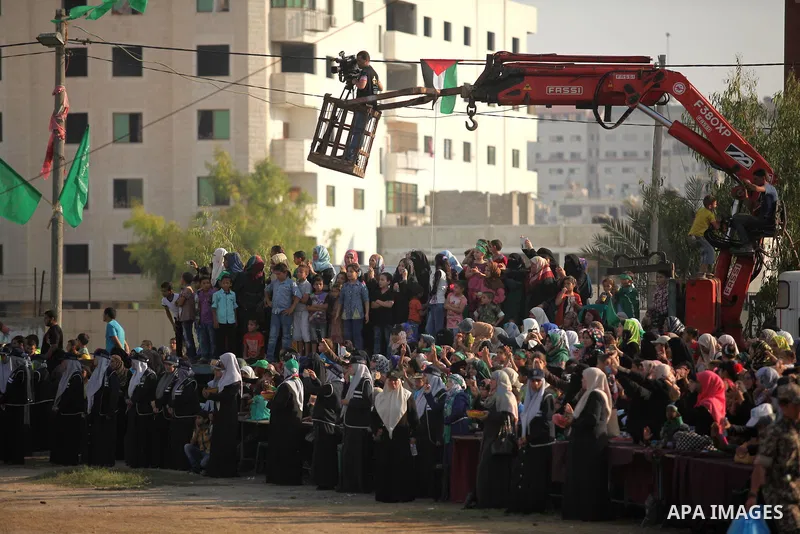 Palestinians attend a graduation ceremony of a military-style camp organized by the Hamas movement in Gaza City on August 5, 2015. Hamas's armed wing organized ''Liberation Youths Camps'' for young Palestinians aged betw...