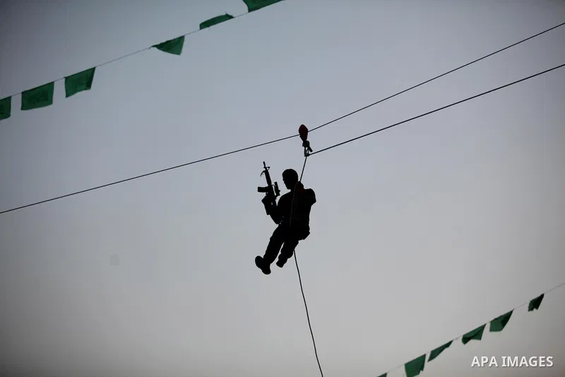 Palestinian youths demonstrate their skills during graduation ceremony of a military-style camp organized by the Hamas movement in Gaza City on August 5, 2015. Hamas's armed wing organized ''Liberation Youths Camps'' for...