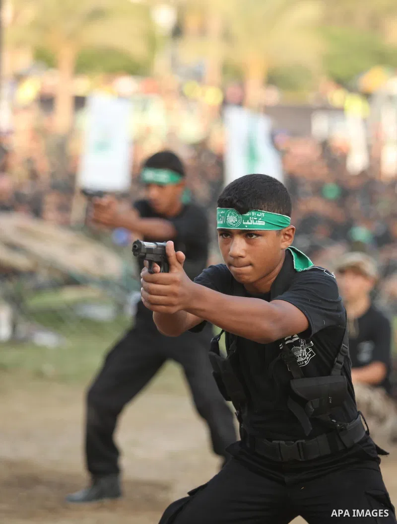 Palestinian youths demonstrate their skills during graduation ceremony of a military-style camp organized by the Hamas movement in Gaza City on August 5, 2015. Hamas's armed wing organized ''Liberation Youths Camps'' for...